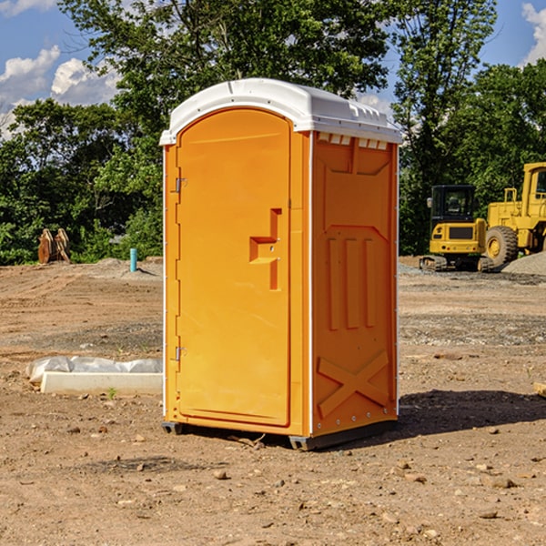 what is the cost difference between standard and deluxe porta potty rentals in Rushville